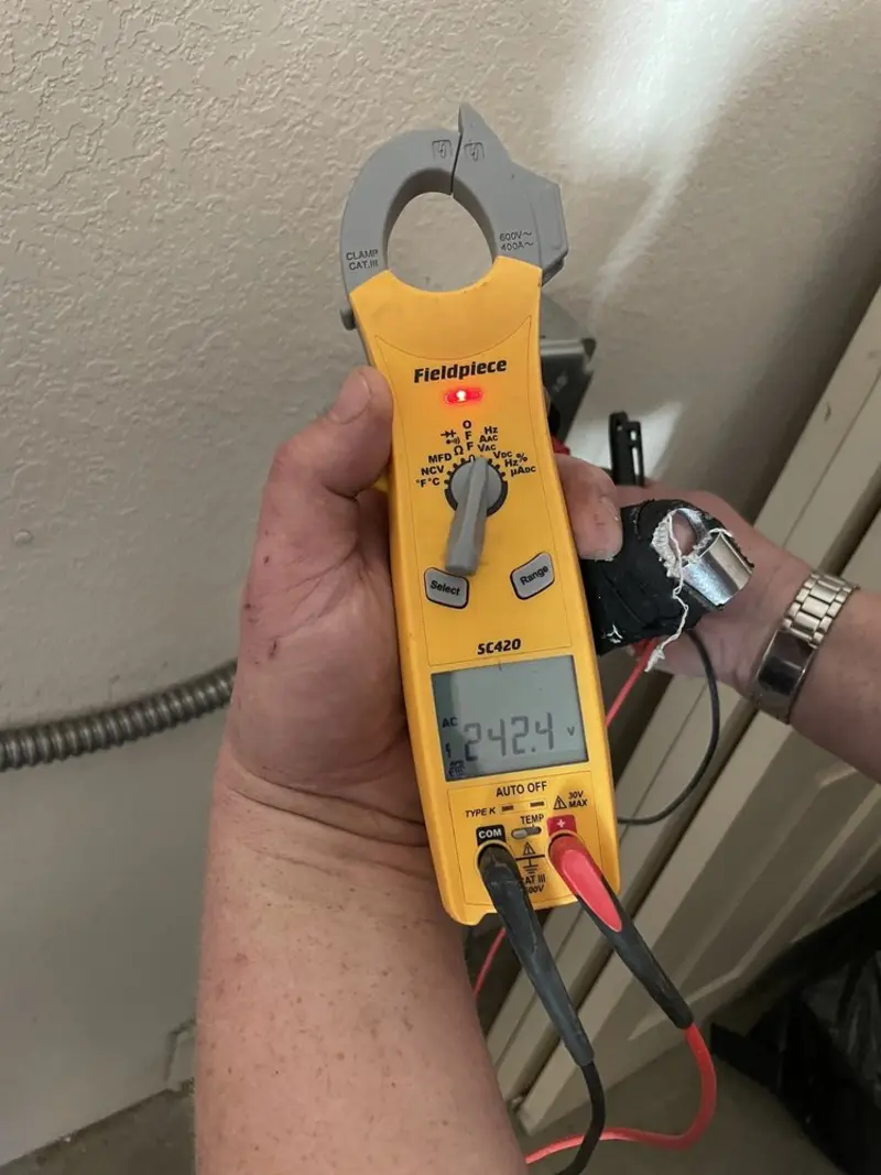 Voltage testing with clamp meter during Ceiling Fan Installation in Canton